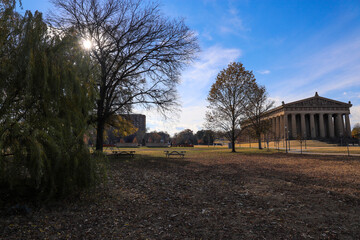 a shot of the The Parthenon in Centennial Park with tall brown stone pillars around the building...