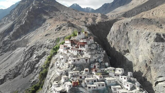 A beautiful aerial drone shot of Diskit Monastery, Nubra Valley, Ladakh. The Buddhist monastery is surrounded by a gorge on the eastern side.
