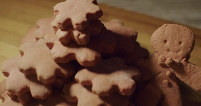 Gingerbread men and snowflake cookies arranged on a table and ready to eat