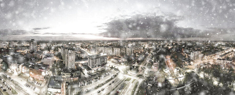 Tychy Poland Winter City Skyline during night with snowflakes