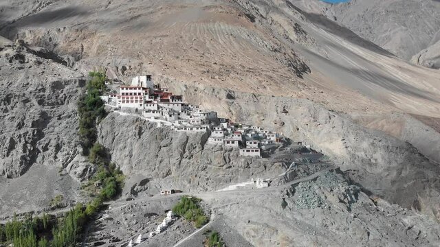 A beautiful aerial drone shot of Diskit Monastery, Nubra Valley, Ladakh. The Buddhist monastery is surrounded by a gorge on the eastern side.