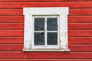 Obraz na płótnie Canvas Latah, Washington State, USA. White framed window in a red barn.