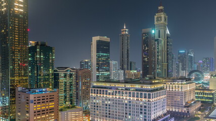 Dubai International Financial district aerial all night timelapse. View of business and financial office towers.