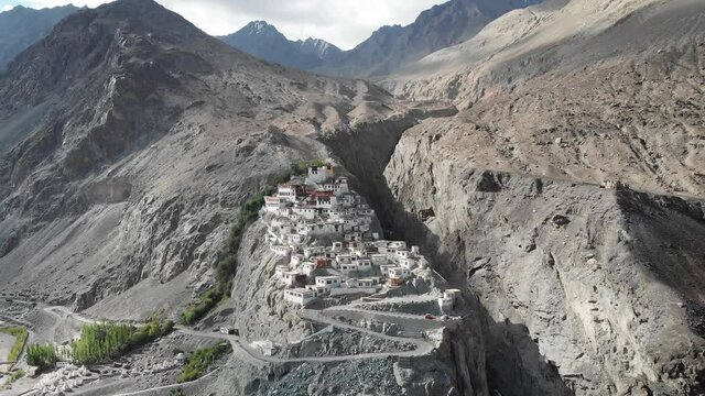 A beautiful aerial drone shot of Diskit Monastery, Nubra Valley, Ladakh. The Buddhist monastery is surrounded by a gorge on the eastern side.