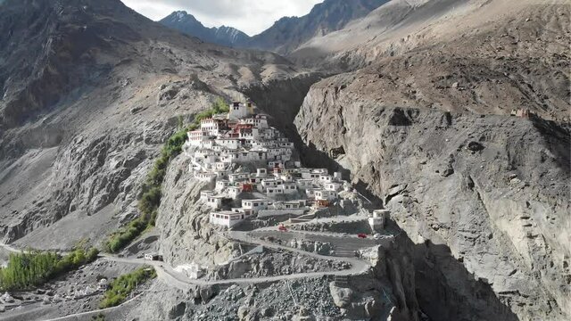 A beautiful aerial drone shot of Diskit Monastery, Nubra Valley, Ladakh. The Buddhist monastery is surrounded by a gorge on the eastern side.