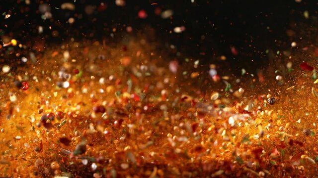 Super slow motion of crushing spice mix in grinder. Filmed on high speed cinema camera, 1000 fps. Speed ramp effect. 