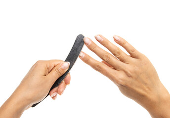filing nails with a file on a white background