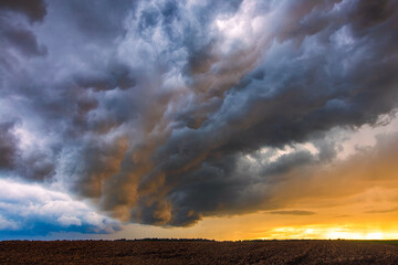 Naklejka na ściany i meble Thunder storm with shelf cloud at sunset, summer, Lithuania