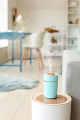 Modern humidifier on table in living room