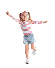 Cute little girl in striped longsleeve dancing on white background