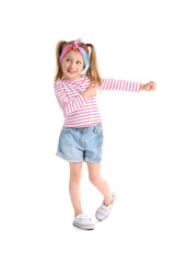 Cute little girl in striped longsleeve dancing on white background