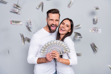 Photo of hooray young brunet couple win money wear white shirt isolated on grey background