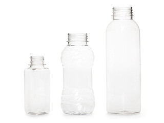 three different empty plastic bottles isolated on white background. production of new containers
