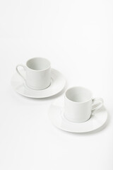 White porcelain cup and saucer for cappuccino and coffee isolated on a white background