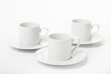White porcelain cup and saucer for cappuccino and coffee isolated on a white background
