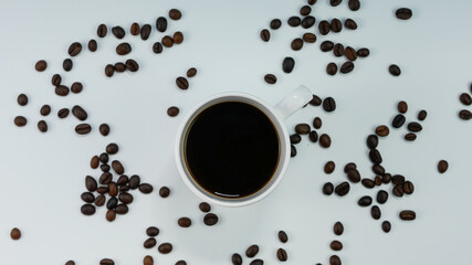 a cup of black coffee, roasted coffee beans isolated. morning drink. ready to work.