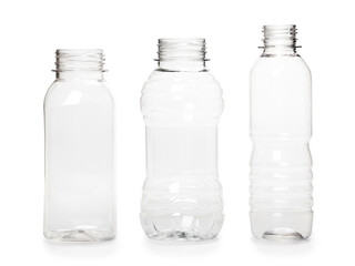 three different empty plastic bottles isolated on white background. production of new containers