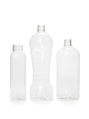 three different empty plastic bottles isolated on white background. production of new containers