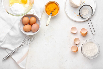 Fresh ingredients for preparing pumpkin pie on light background