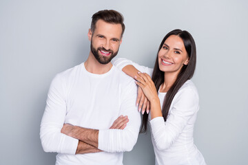 Photo of pretty charming brother sister dressed white shirts smiling isolated grey color background