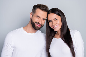 Obraz premium Photo of pretty funny young brother sister dressed white shirts smiling isolated grey color background