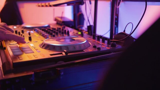 Mainstream Electro House DJ Crossfading Upbeat Track On Turntable At Wedding 