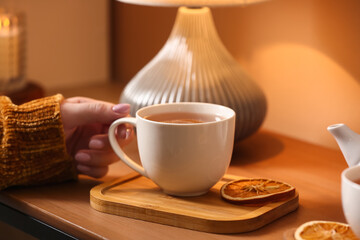 Cup of tasty tea on table in cafe