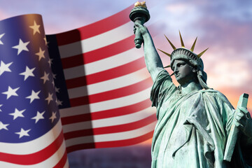 Statue of Liberty USA. Liberty Enlightening World in New York. Waving flag of America on sunset background. Monument dedicated to independence of America. Symbols of United States of America.