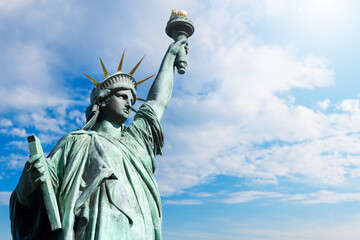 USA Statue of Liberty on sky background. Close-up of New York Statue of Liberty. Monument of woman...