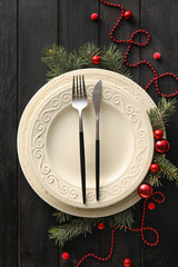 Beautiful Christmas table setting with decor on dark wooden background