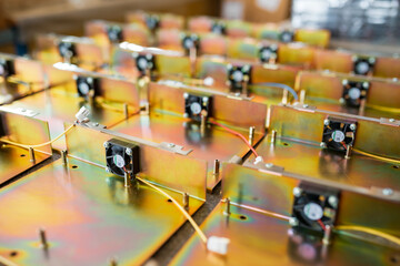 Rainbow metal details of TFT displays on table in workshop