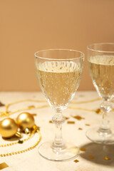 Glasses of champagne on light table, closeup