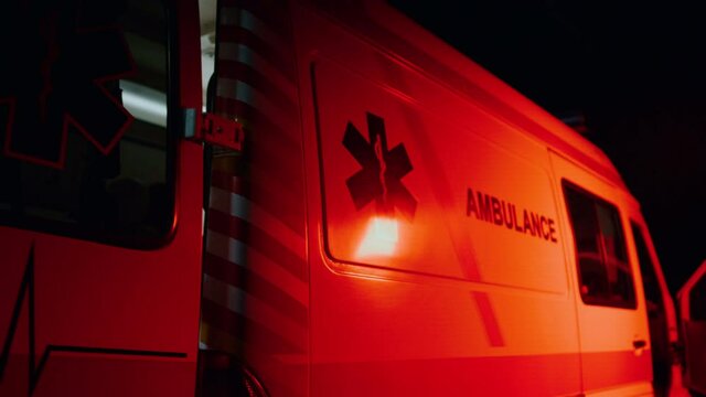 Closeup emergency body of car with logo. Ambulance vehicle with emblem