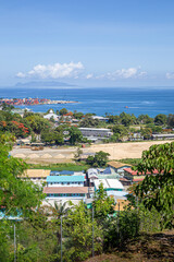 View of Savo Island in the distance, over Chinatown in Honiara, Solomon Islands.
