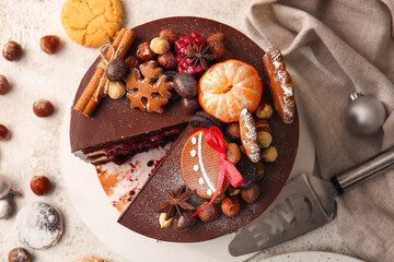 Stand with tasty Christmas chocolate cake on light background