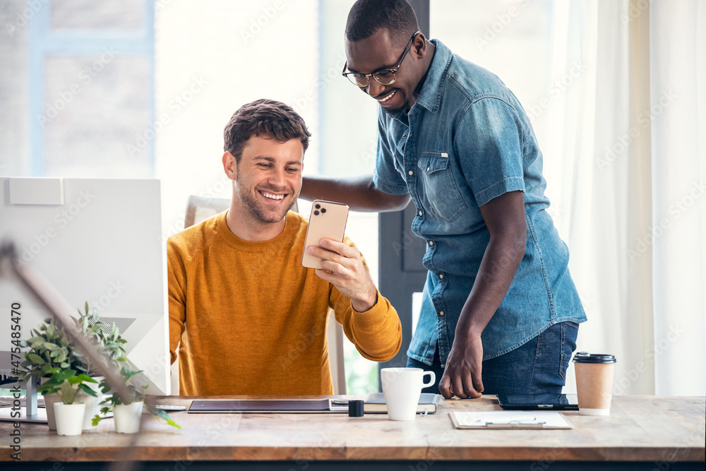 Aufkleber two graphic designer working with computer while looking smartphone with his colleague in modern sta