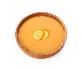 Bowl of tasty kumquat jam on white background