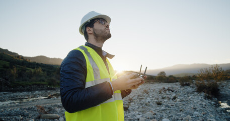 engineer with remote controller of drone