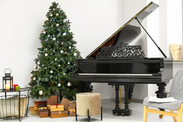 Interior of living room with grand piano and Christmas tree