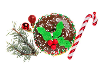 Tasty Christmas donut with fir tree branch, balls and candy cane on white background