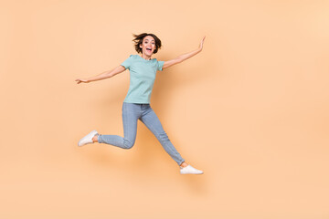 Full length photo of young cheerful lady jumper wear casual outfit isolated over beige color background