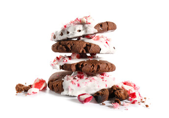 Tasty candy cane cookies on white background