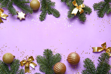 Christmas balls and fir branches on purple background