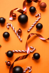 Beautiful Christmas composition with decor on orange background