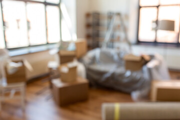 moving and real estate concept - boxes with stuff at new home