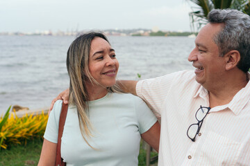 Outdoor portrait of a 50-year-old couple in the park