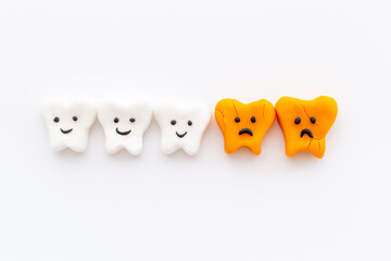Teeth models with caries or plaque on gums. Oral health concept