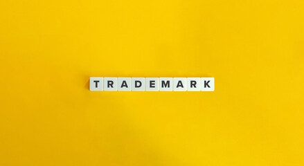 Trademark banner. Block letters on bright orange background. Minimal aesthetics.