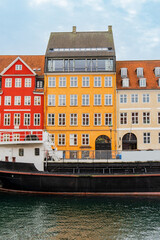 Naklejka premium Copenhagen, Denmark - October 1, 2021: Detail of the facade of a house in Nyhavn, in the historical center of Copenhagen