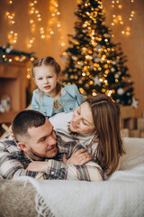 Family with little daughter together on Christmas